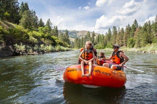 A family rafting on a river.