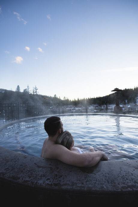 couple sitting in hot tub at The Springs
