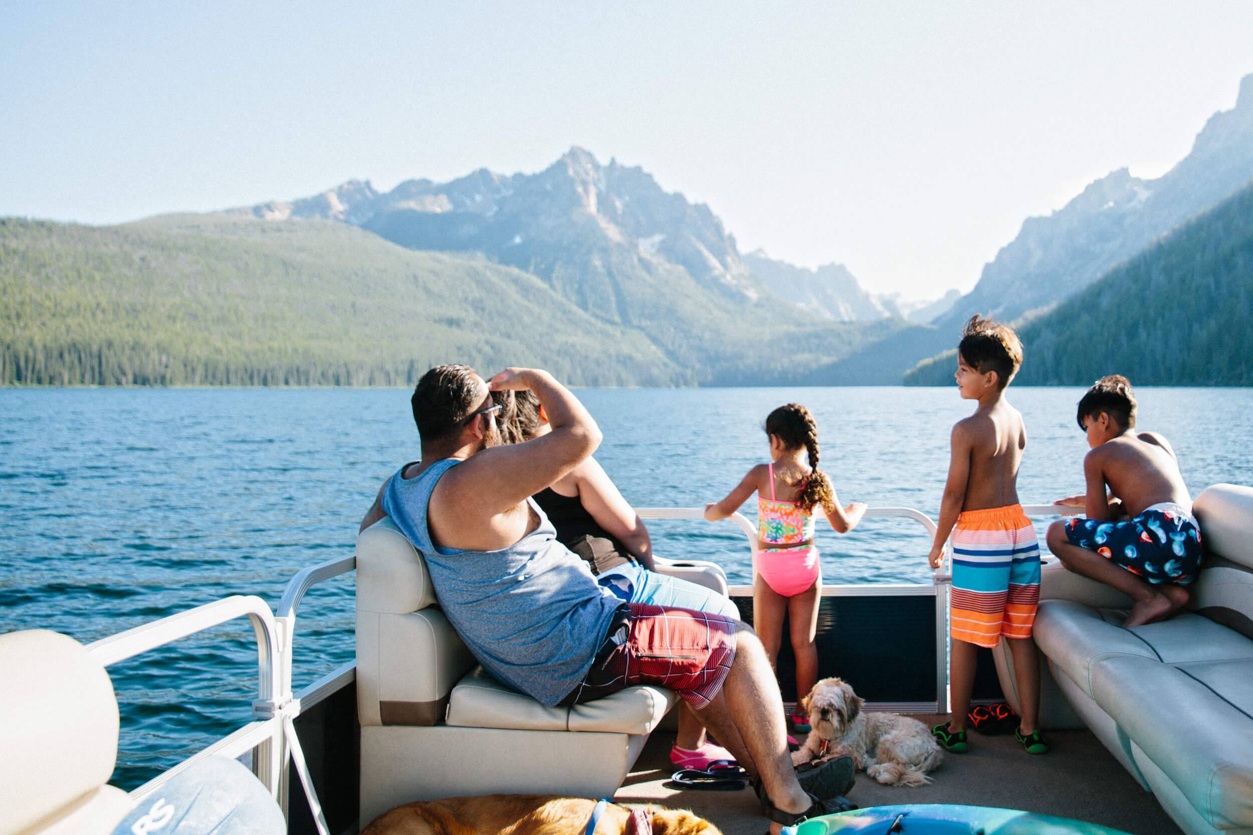A family on a boat on Redfish Lake.