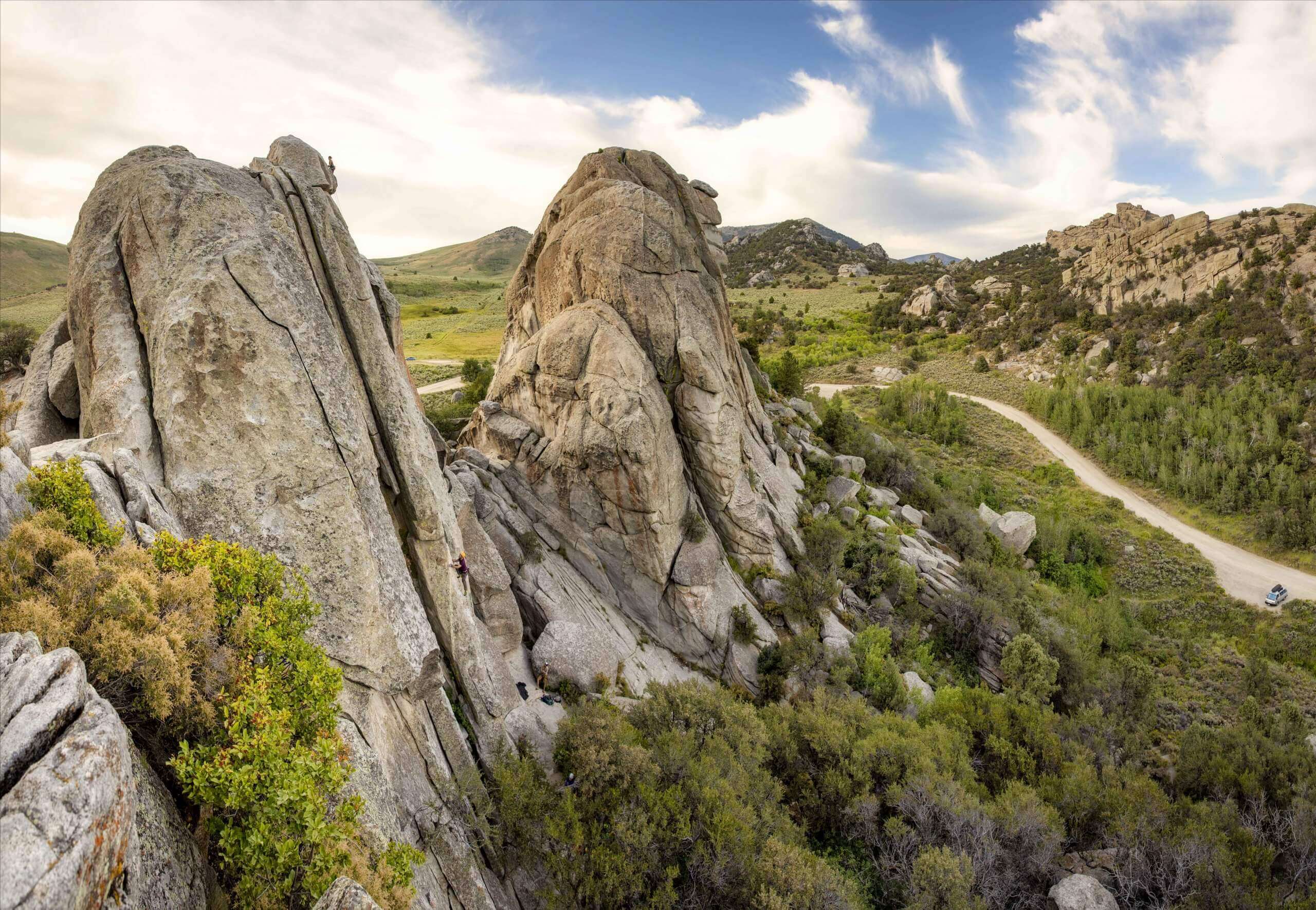 View of giant rocks surrounded by shrubs at City of Rocks National Reserve.