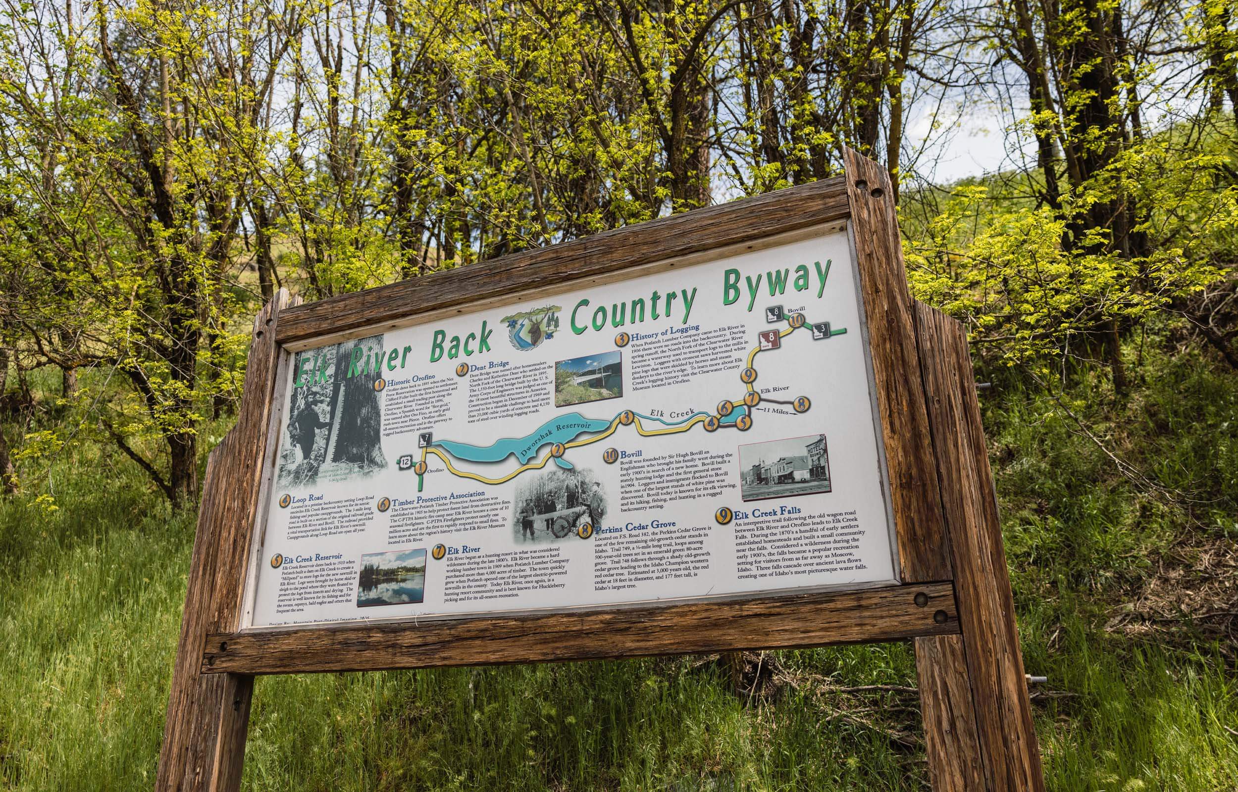 A wooden sign sharing facts and a map of the Elk River Backcountry Byway.