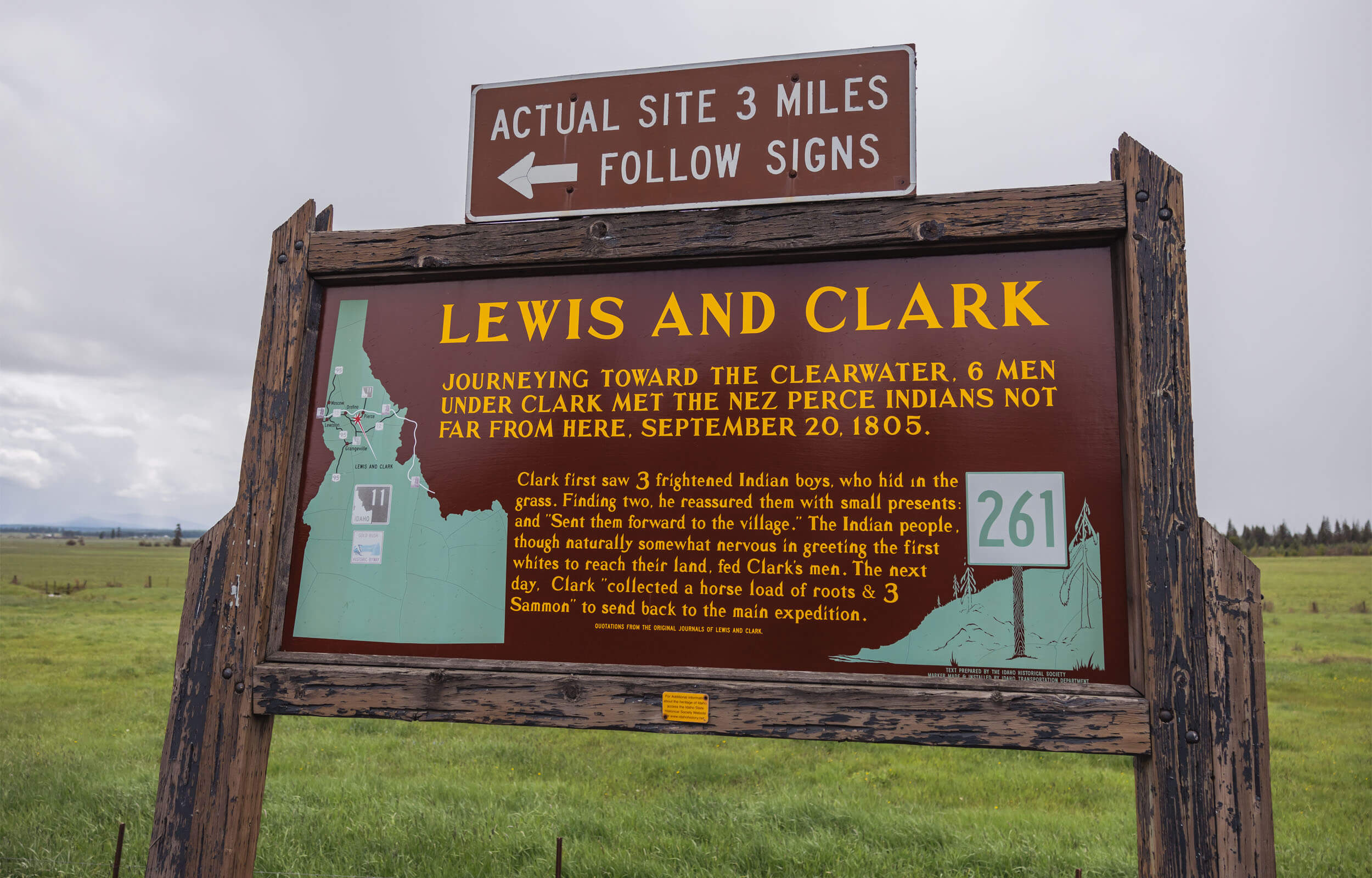 A wooden sign with historical information about the Lewis and Clark Expedition near Weippe.