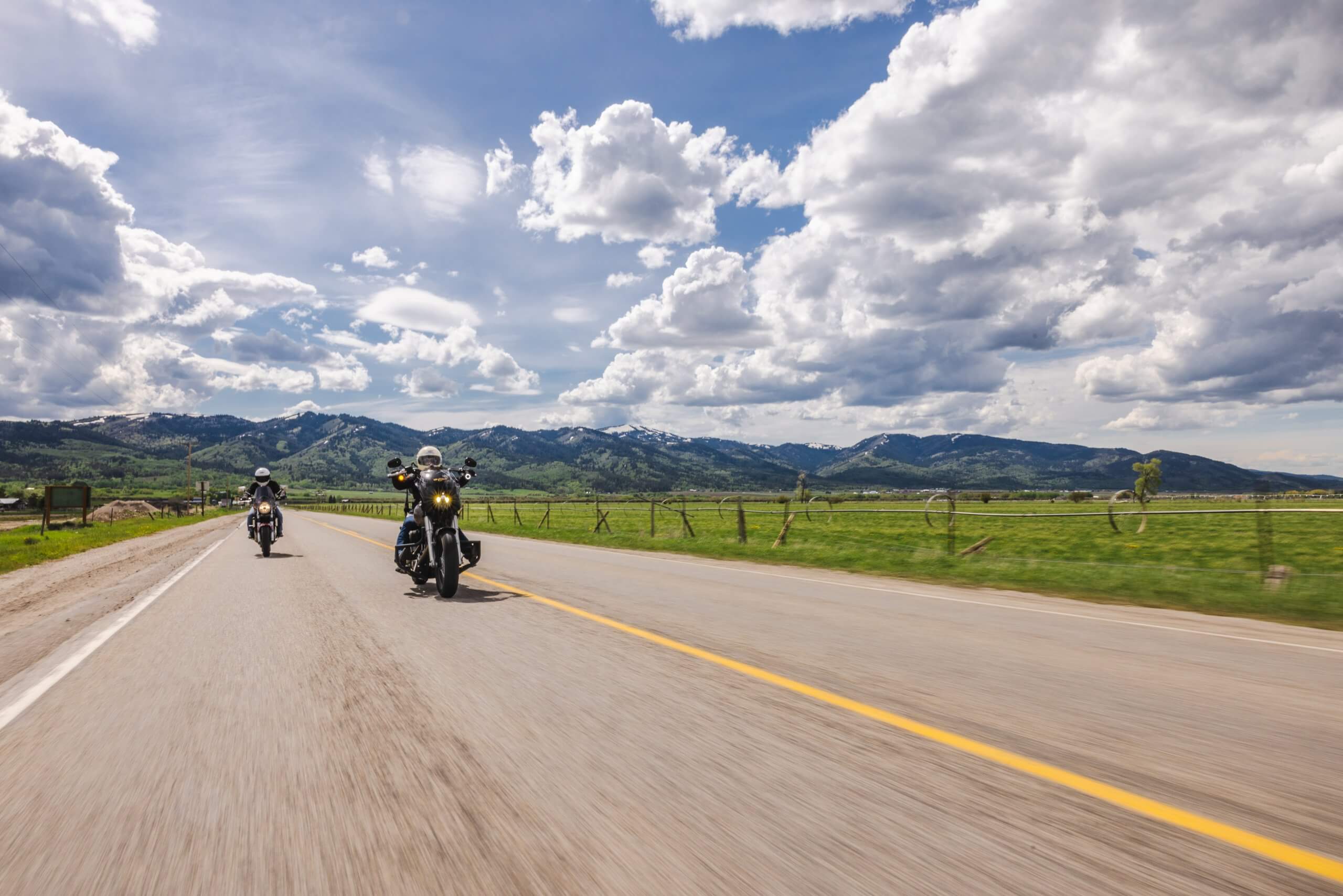Motorcyclists riding down a mountain highway