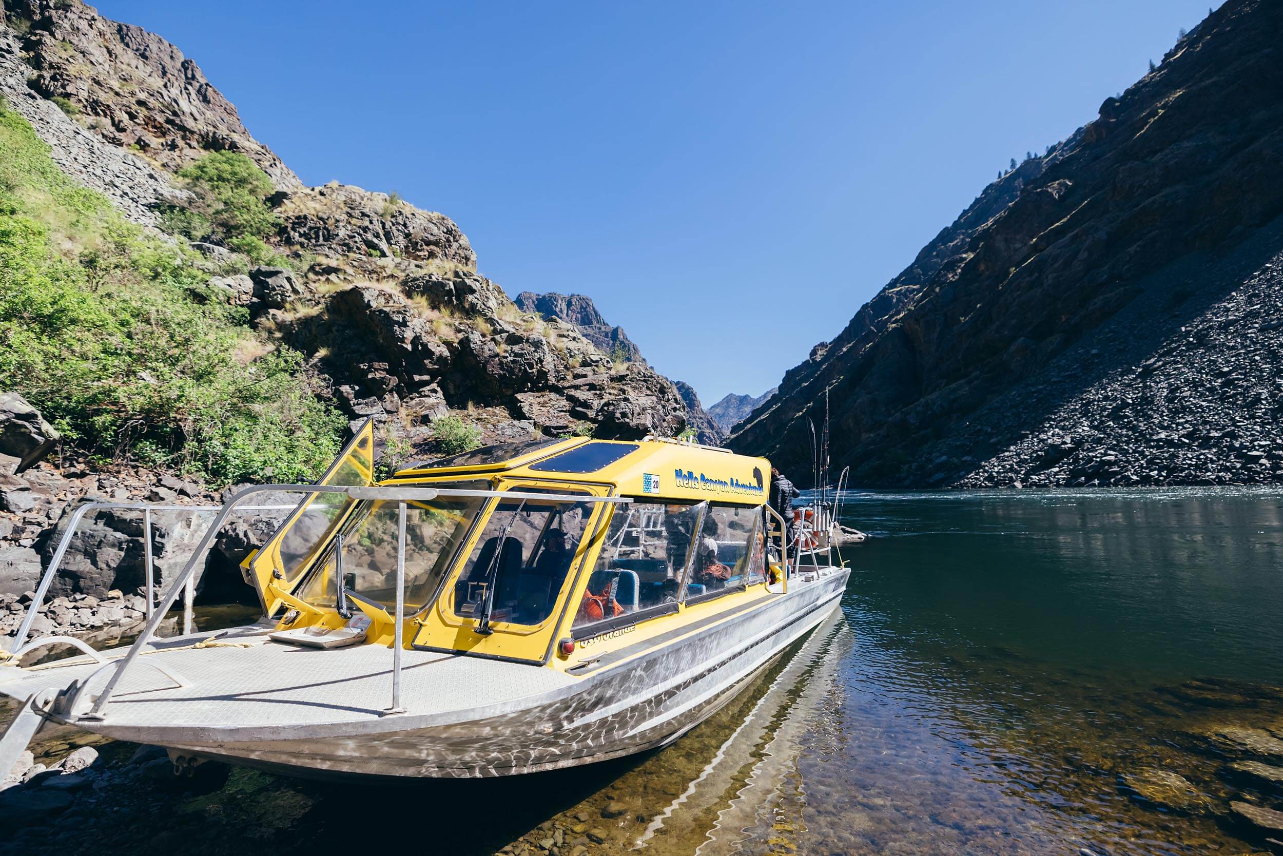 closeup of a jet boat on a river within a canyon