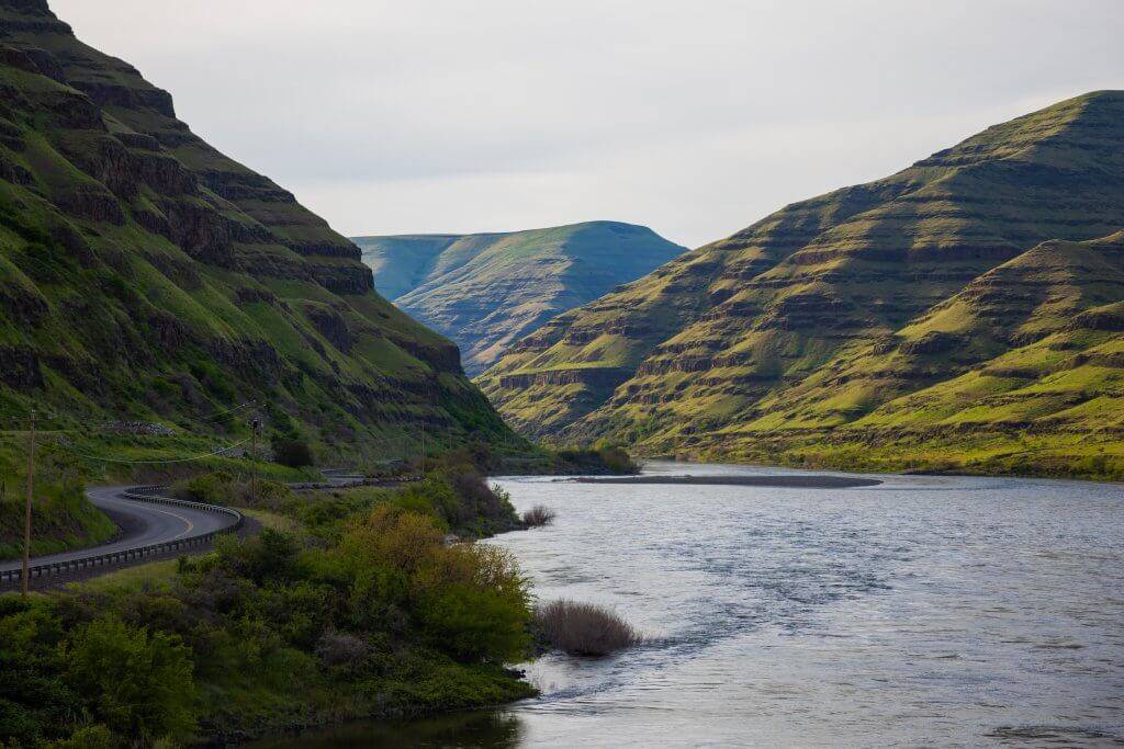 The Northwest Passage Scenic Byway winding along the Snake River in Hells Canyon at Hells Gate State Park.