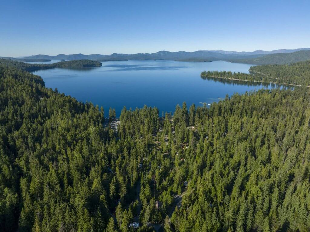 Aerial view of Indian Creek Bay at Priest Lake, surrounded by forest in Priest Lake State Park.