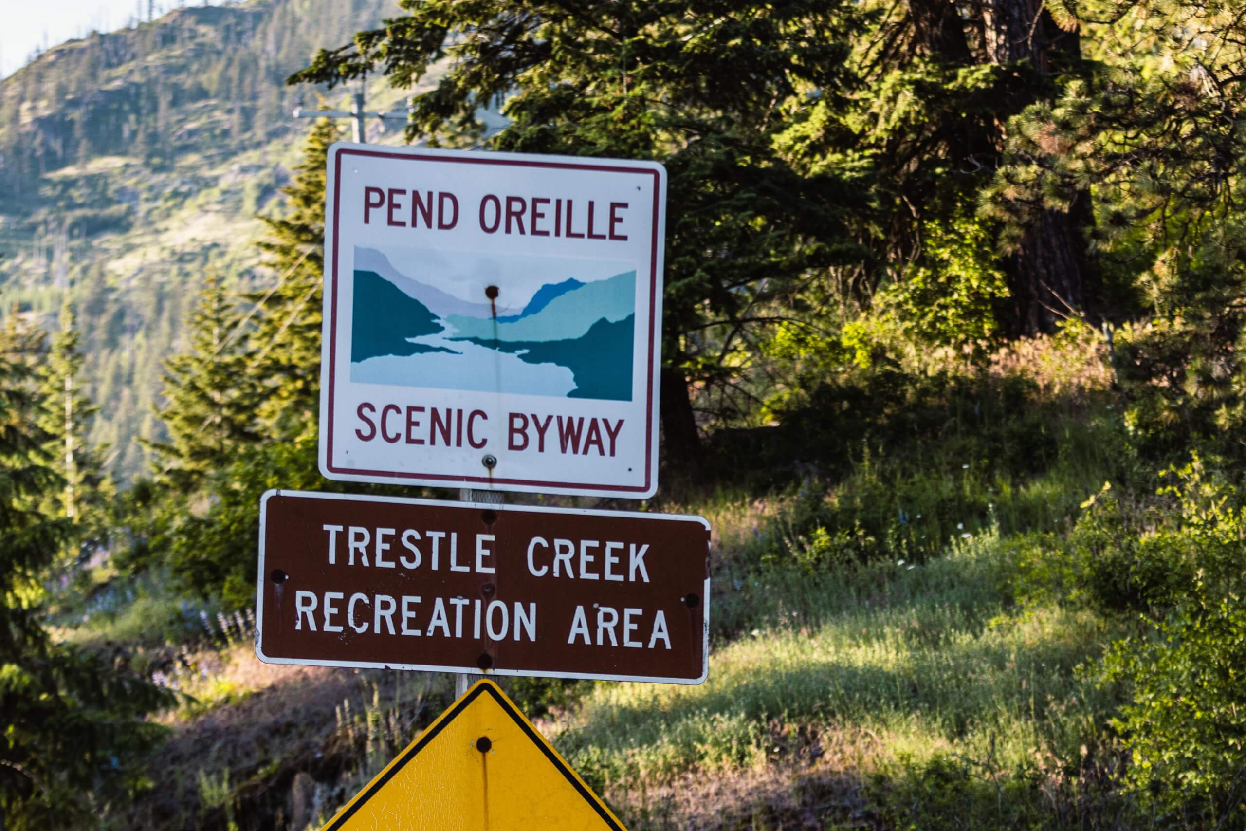 A roadside sign for Pend Oreille Scenic Byway and Trestle Creek Recreation Area.