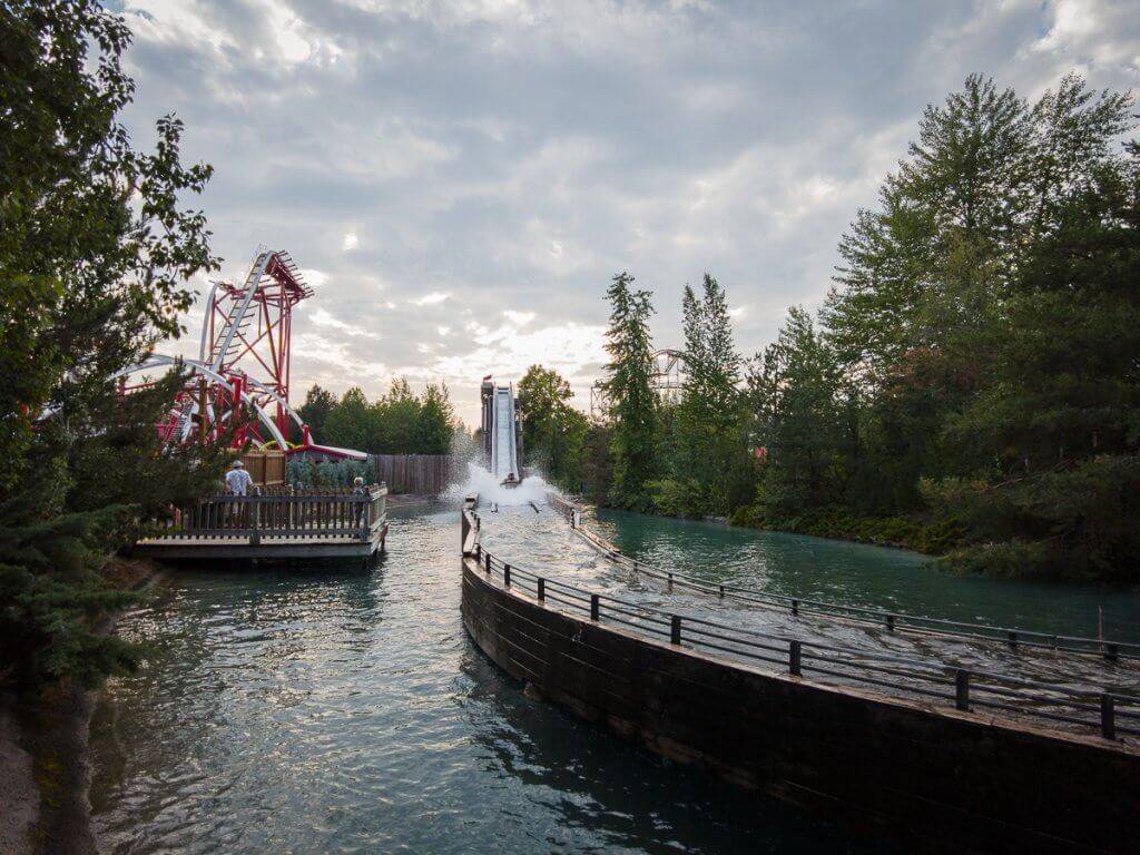 Wide shot of Silverwood Theme Park with rollercoaster track and log ride.