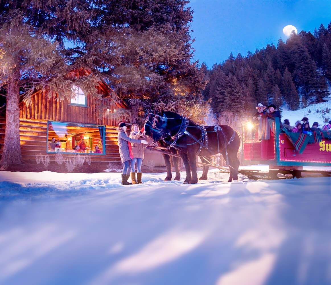People preparing for a night time sleigh ride in Sun Valley.
