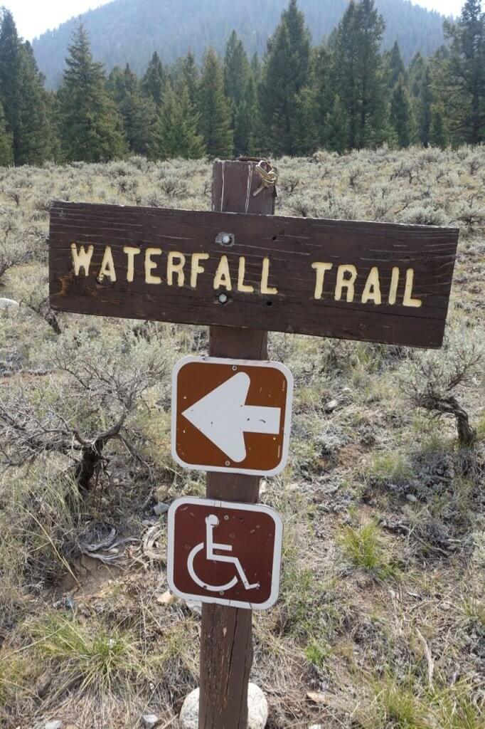A wooden sign for Waterfall Trail near Sun Valley.